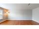 A spacious bedroom with hardwood floors, a lamp, and large windows for natural light at 3198 Conservancy Ln, Charleston, SC 29414