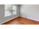 Bright bedroom features hardwood floors and a large window with natural light at 3198 Conservancy Ln, Charleston, SC 29414