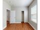 A bright bedroom has hardwood floors, neutral walls, closet, and a window allowing plenty of natural light at 3198 Conservancy Ln, Charleston, SC 29414