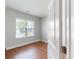An inviting bedroom is filled with natural light, featuring a hardwood floor and neutral walls at 3198 Conservancy Ln, Charleston, SC 29414