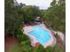 An aerial view of a community pool with surrounding trees and lounge seating at 3198 Conservancy Ln, Charleston, SC 29414