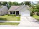 Well-maintained single-Gathering home with a two-car garage, manicured lawn and trimmed bushes at 3198 Conservancy Ln, Charleston, SC 29414