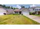 Charming single-Gathering home featuring manicured lawn, landscaping, and a two-car garage at 3198 Conservancy Ln, Charleston, SC 29414