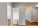 A hallway leads to a tiled bathroom featuring a bathtub and shower, plus doors to other rooms at 3198 Conservancy Ln, Charleston, SC 29414