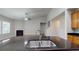 Close up of the kitchen island with granite countertops and stainless steel double sink and faucet at 3198 Conservancy Ln, Charleston, SC 29414