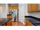Gourmet kitchen boasts stainless appliances, granite counters, and wooden cabinets at 3198 Conservancy Ln, Charleston, SC 29414