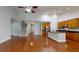 Open concept living room and kitchen featuring hardwood floors and a staircase at 3198 Conservancy Ln, Charleston, SC 29414