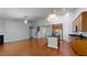 Open concept living room and kitchen with hardwood floors and stainless appliances at 3198 Conservancy Ln, Charleston, SC 29414