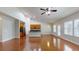Spacious open-concept living room and kitchen with hardwood floors, light-filled space, and modern design at 3198 Conservancy Ln, Charleston, SC 29414