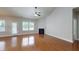 Spacious living room featuring a fireplace, ceiling fan, and ample natural light from several windows at 3198 Conservancy Ln, Charleston, SC 29414