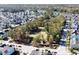 Aerial view of a community featuring green spaces and a lake at 3198 Conservancy Ln, Charleston, SC 29414