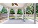View of a charming screened porch with curtains, an outdoor ceiling fan, and an open backyard view at 3198 Conservancy Ln, Charleston, SC 29414