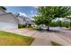 Street view of homes showcasing appealing exterior design, driveways, well-maintained landscaping, and sidewalks at 3198 Conservancy Ln, Charleston, SC 29414
