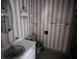 Bathroom with toilet, vanity with sink, mirror and striped wallpaper at 321 Fairington Dr, Summerville, SC 29485