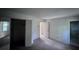 Bedroom with closet, bathroom, painted and wallpapered walls and bare concrete floors at 321 Fairington Dr, Summerville, SC 29485