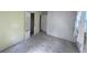 Bedroom with closet, painted and wallpapered walls and bare concrete floor at 321 Fairington Dr, Summerville, SC 29485