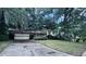 Home exterior featuring an attached garage and a large driveway at 321 Fairington Dr, Summerville, SC 29485