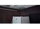 View of a kitchen with wood paneling, a refrigerator, and a ceiling fixture at 321 Fairington Dr, Summerville, SC 29485