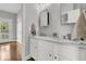 Modern bathroom features double sink vanity with white cabinets and marble countertop, with access to the porch at 3224 Hatchway Dr, Mount Pleasant, SC 29466
