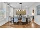 Formal dining room with hardwood floors, modern chandelier, and ample seating for guests at 3224 Hatchway Dr, Mount Pleasant, SC 29466
