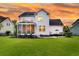 Exterior view of a beautiful two-story home featuring a screened porch at 3224 Hatchway Dr, Mount Pleasant, SC 29466