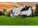 Well-manicured backyard with outdoor seating area and lush lawn at 3224 Hatchway Dr, Mount Pleasant, SC 29466