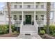 Close-up of the home's front entrance, highlighting the elegant door, porch, and manicured landscaping at 3224 Hatchway Dr, Mount Pleasant, SC 29466
