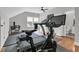 Spacious home gym with hardwood floors, vaulted ceilings, workout equipment and natural light at 3224 Hatchway Dr, Mount Pleasant, SC 29466