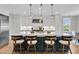 Modern kitchen with a large island, pendant lighting, stainless steel appliances, and stylish bar stools at 3224 Hatchway Dr, Mount Pleasant, SC 29466