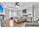 Spacious main bedroom with a tray ceiling, hardwood floors, and a seating area at 3224 Hatchway Dr, Mount Pleasant, SC 29466