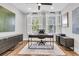 Well-lit home office with custom built-ins, hardwood floors, and a ceiling fan at 3224 Hatchway Dr, Mount Pleasant, SC 29466