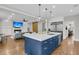 Open-concept living space featuring a modern kitchen island with seating, seamlessly connected to the living area at 3224 Hatchway Dr, Mount Pleasant, SC 29466