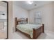 Cozy bedroom features a wooden bed frame, soft bedding, and a window providing natural light at 339 Iveson Rd, Summerville, SC 29486