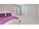 Bright bedroom with plush carpeting, large window, and a comfortable bed with purple bedding at 339 Iveson Rd, Summerville, SC 29486