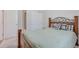 Comfortable bedroom with a decorative bed frame, soft linens, and a view into the hallway at 339 Iveson Rd, Summerville, SC 29486