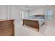 Bedroom featuring a wooden bed frame, dresser, and ample natural light from two windows at 339 Iveson Rd, Summerville, SC 29486