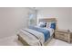 Inviting bedroom with a wooden bed frame and soft blue accents, complemented by natural light at 339 Iveson Rd, Summerville, SC 29486