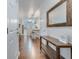 Inviting entryway with dark wood floors, a wooden console table, mirror, and view of the dining and kitchen area at 339 Iveson Rd, Summerville, SC 29486