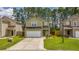 Beautiful two-story home featuring a garage, well-kept lawn, and lovely landscaping at 339 Iveson Rd, Summerville, SC 29486
