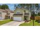 Two story home with attached garage, manicured lawn, and beautiful landscaping at 339 Iveson Rd, Summerville, SC 29486