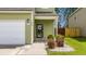 Exterior of home with view of walkway leading to front door, landscape, and attached garage at 339 Iveson Rd, Summerville, SC 29486