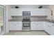 Well-lit kitchen with white cabinets, stainless steel appliances, and granite countertops at 339 Iveson Rd, Summerville, SC 29486