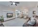 Open concept living area with stylish decor, modern lighting, and an easy flow into the dining and kitchen spaces at 339 Iveson Rd, Summerville, SC 29486