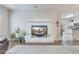 Bright living room with an entertainment center, modern decor, and a view of the kitchen at 339 Iveson Rd, Summerville, SC 29486