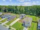 Aerial view of homes with spacious lawns and driveways, in a well-planned neighborhood setting at 352 Matuskovic Dr, Charleston, SC 29414