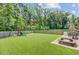 Large backyard featuring green lawn, patio and playground, perfect for outdoor activities at 352 Matuskovic Dr, Charleston, SC 29414