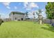 Spacious backyard featuring a lush green lawn and a wooden playset for entertainment and enjoyment at 352 Matuskovic Dr, Charleston, SC 29414
