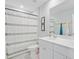 Bathroom with shower/tub combo, modern fixtures, framed mirror and bright vanity at 352 Matuskovic Dr, Charleston, SC 29414