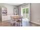 Bright dining area featuring wood floors, natural light from sliding glass doors, and built-in shelving for storage and display at 352 Matuskovic Dr, Charleston, SC 29414