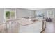 Open kitchen with granite island, stainless steel appliances, and seamless flow to the dining area at 352 Matuskovic Dr, Charleston, SC 29414